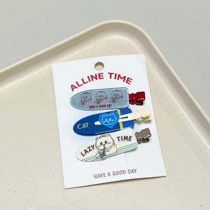 Three-piece cat-themed hair clip set with cute blue and beige duckbill clips on card