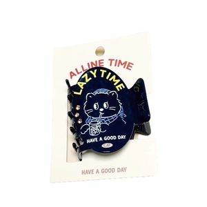 Navy blue cat hair clip with lazy time design and rhinestones on white card