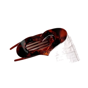 Elegant tortoiseshell claw clip with amber resin texture and wave minimalist design