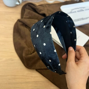 Vintage black velvet wide headband with white polka dots for a retro stylish hair accessory