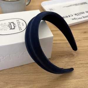 Detail view of navy blue velvet headband featuring a wide design and soft plush texture