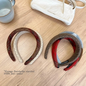 Detailed view of handmade plaid wool headband set in four vintage winter colors