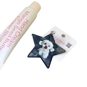 Star-shaped black hair claw featuring a cute Maltese dog print and star embellishments