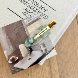 French acetate hair clip with marble texture and golden logo for hair styling