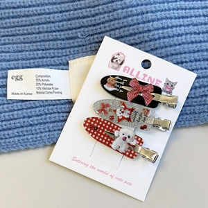 Detailed set of three retro plaid duckbill hair clips for women on brand display card