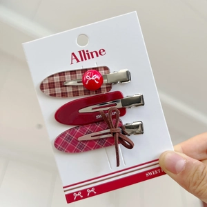 Three-piece set of red plaid and polka dot hair clips with sweet bow accents for women