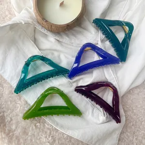 Set of colorful triangular hollow hair claws in high gloss acrylic with gold metal springs