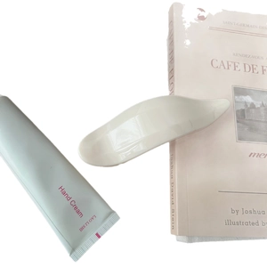 White ceramic massage scraper and light green hand cream kit for body skin care