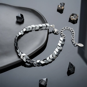 Minimalist grey hematite diamond-shaped arrow bracelet with adjustable lobster clasp and chain