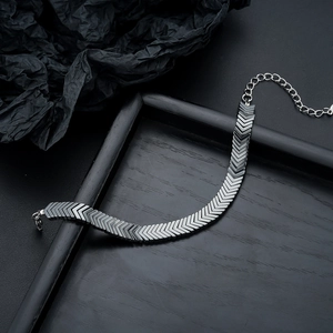 Arrow-link hematite bracelet in matte black finish with adjustable lobster clasp