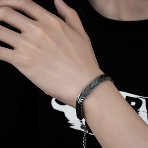 Close-up of black chevron link bracelet with lobster clasp on male wrist