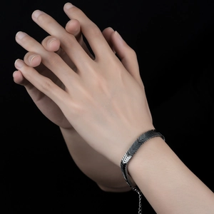 Men's silver hematite chevron link bracelet with lobster clasp in a modern minimalist style