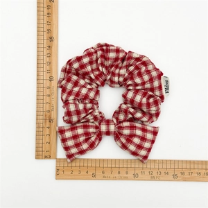 Red and white plaid bow scrunchie with elastic cotton fabric, size measurement view