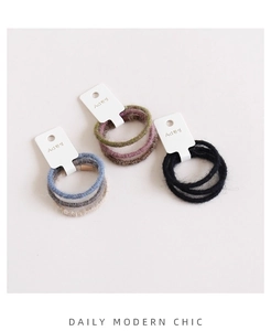 Tre set di elastici per capelli in maglia testurizzata in vari colori