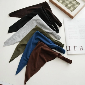 Close-up of 6-piece elastic knit headbands in dark brown, olive green, and royal blue