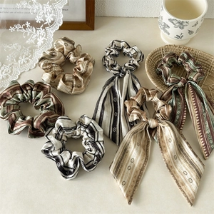 Ethnic style satin silk scrunchies with long ribbons in bohemian prints and earthy tones