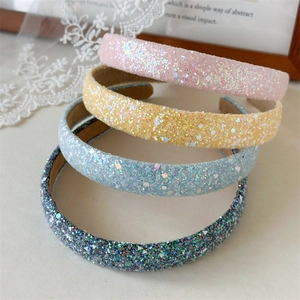 Set of four sparkling glitter headbands in pink, yellow, blue, and grey for women