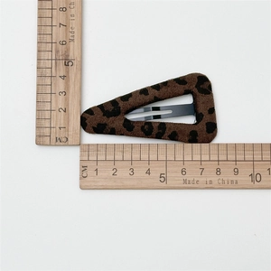 Plush leopard print triangle BB hair clip with velvet texture shown with scale measurement