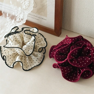Set of two polka dot scrunchies in cream and burgundy with ruffled chiffon texture
