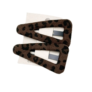 Leopard print plush triangle BB hair clips for women in a two-piece set on white display