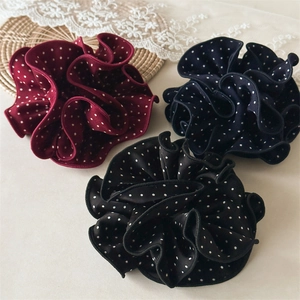 Polka dot scrunchies in burgundy navy and black showing soft fabric texture