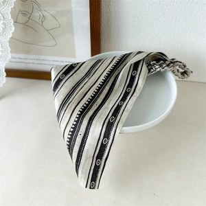 Close-up of high-elasticity geometric pattern triangle headscarf with elastic band detail