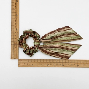 Ethnic style hair scrunchie with ribbons measuring approximately 19cm by 12cm