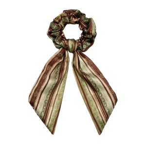 Ethnic style satin scrunchie with long ribbons and retro geometric print in earth tones