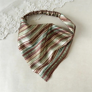 Detailed view of bohemian style elastic headwrap with satin stripes and pleated band