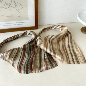 Detail of silk satin bohemian headbands with elastic bands in vintage stripe patterns