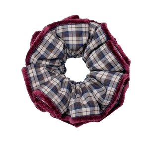 Plaid scrunchie with burgundy faux fur trim on a minimalist white background