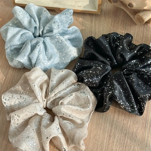 Three-pack large fabric scrunchies in blue, beige, and black with silver foil accents