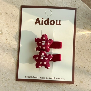 Detail of red polka dot star fabric BB clips with beads on a display card