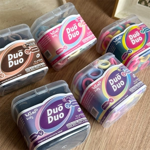 Close-up of durable elastic hair ties in a clear box with focus on polyester texture
