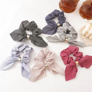 Striped bunny ear scrunchies set in six colors with elegant gold ring accents