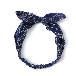 Dark blue paisley pattern headband with rabbit ear bow and elastic back for women