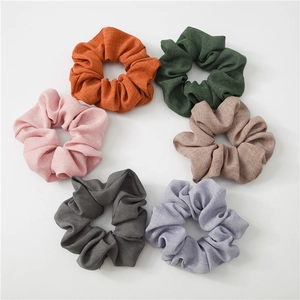 Set of 6 solid color scrunchies in linen-like fabric, featuring natural textured earthy tones