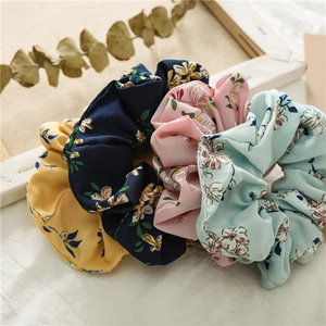 Floral fabric hair scrunchies set in navy, pink, yellow and blue colors for women