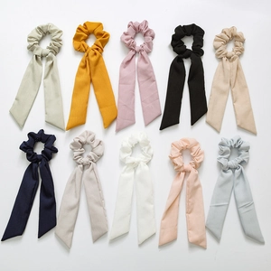 10-piece set of ribbed fabric ponytail holders with long streamers in multiple colors