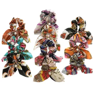 Set of 9 floral silk hair scrunchies with long bow ribbons and pearl embellishments
