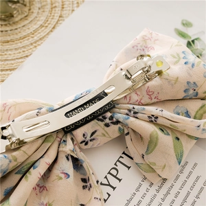 Floral chiffon bow hair clip with silver spring metal clasp and handmade craft details