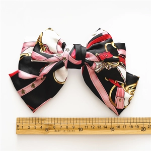 Three-layer satin hair bow with vintage chain floral print, 16cm width on white background