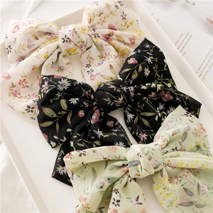 Three-piece set of floral chiffon bow hair clips in beige, black and light green colors