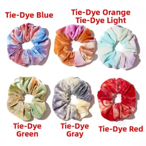 Detailed close-up showing soft tie-dye velvet texture and stitching of the scrunchies