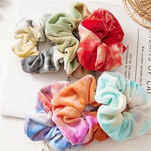 Five-piece tie-dye velvet scrunchies set with vibrant autumn colors on a white backdrop
