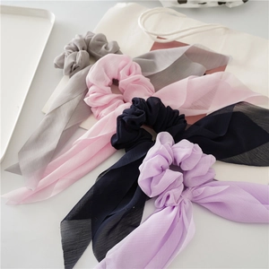 Elegant chiffon scrunchies with long ribbons in four soft pastel colors for women