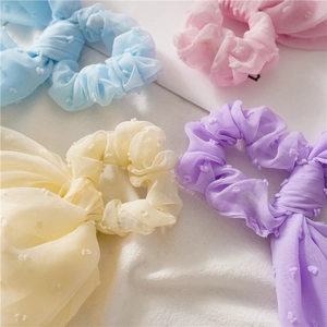 Pastel seersucker scrunchies with long ribbons and jacquard polka dots in four colors