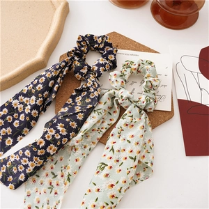 Floral chiffon hair scrunchies with long ribbon ties in daisy and wildflower prints