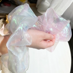 Iridescent organza scrunchies in pearl white and pink showing dreamy pearlescent glow