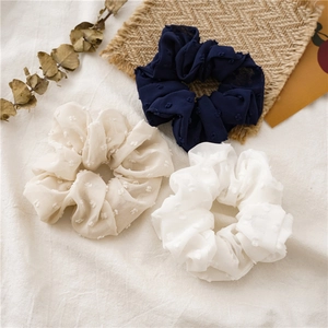 Three-piece set of seersucker hair scrunchies with dot texture in blue and white